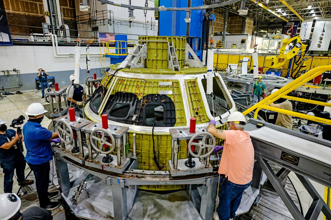 At NASA's Michoud Assembly Facility in New Orleans, Orion's newly completed pressure vessel for the Artemis III mission is lifted out of the welding tool on Aug. 27, 2021. The pressure vessel is the primary structure for Orion's crew module, joined together using state-of-the-art welding by technicians from lead contractor Lockheed Martin.