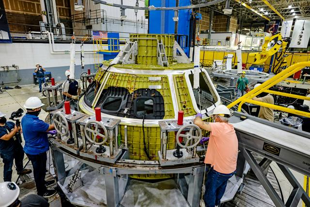 NASA image: Orion crew module pressure vessel lifted from welding tool
