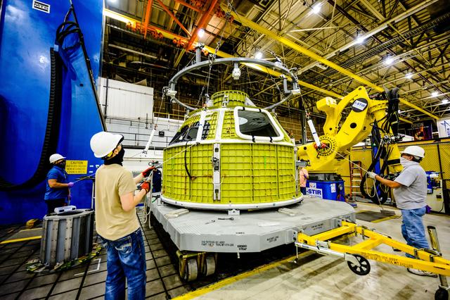 NASA image: Orion crew module pressure vessel lifted from welding tool
