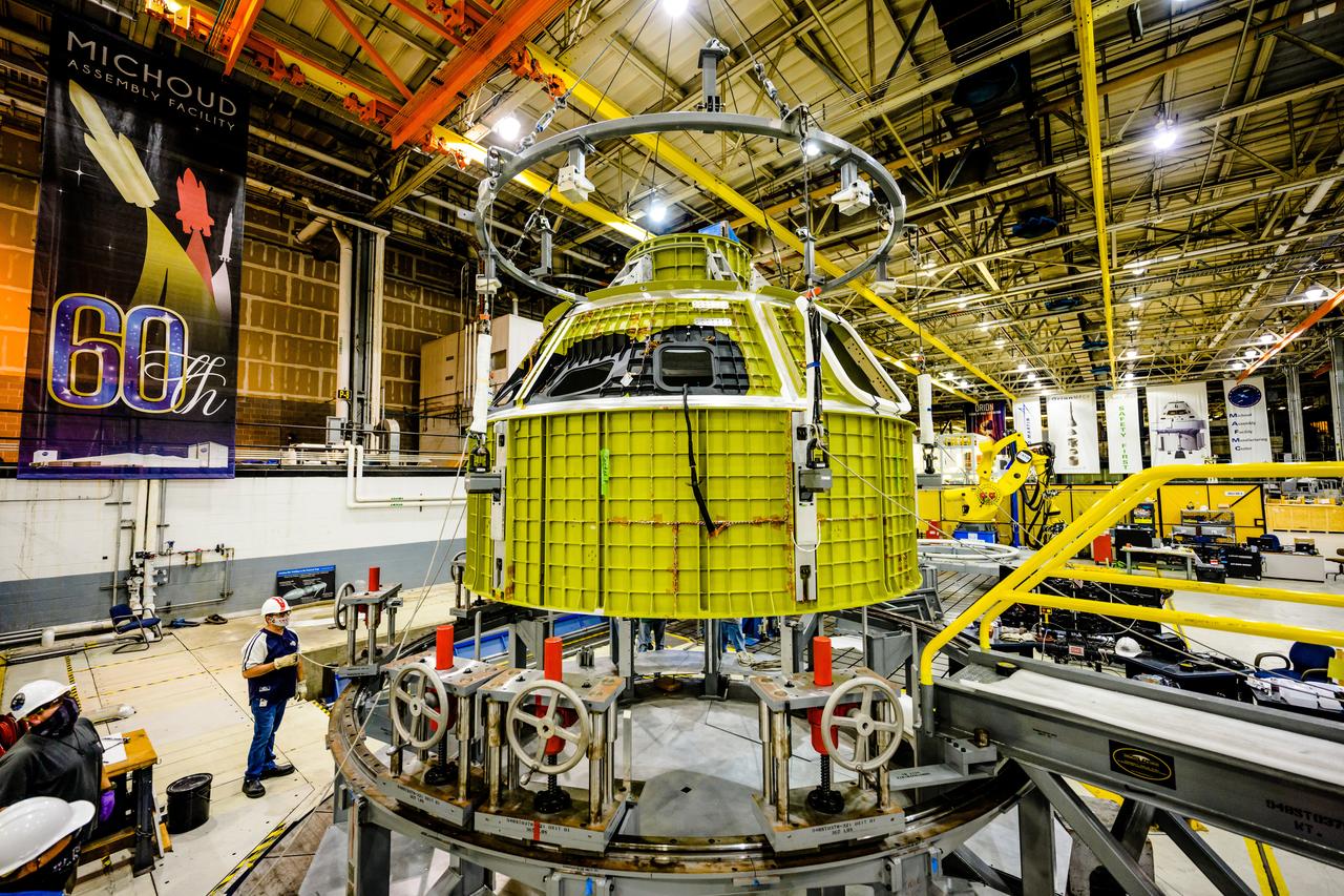 At NASA's Michoud Assembly Facility in New Orleans, Orion's newly completed pressure vessel for the Artemis III mission is lifted out of the welding tool on Aug. 27, 2021. The pressure vessel is the primary structure for Orion's crew module, joined together using state-of-the-art welding by technicians from lead contractor Lockheed Martin.