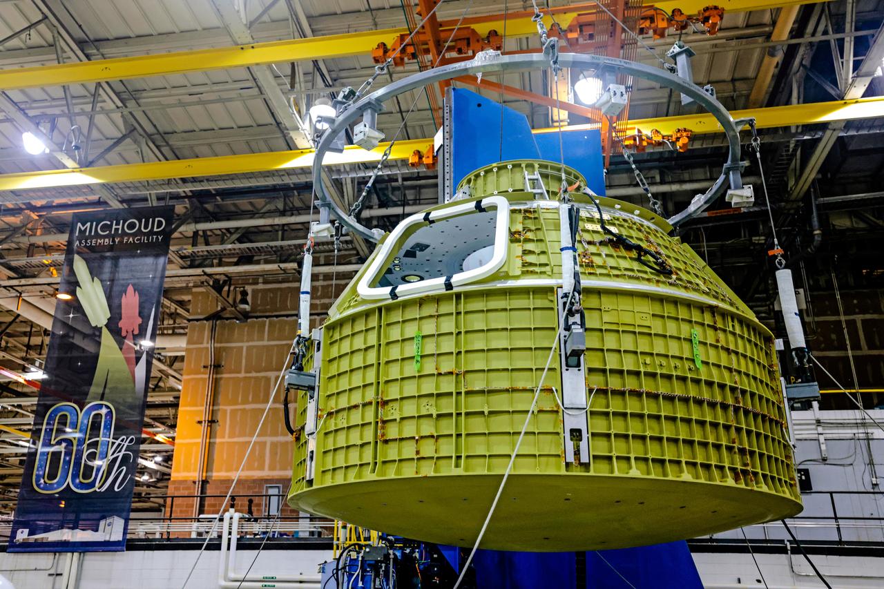 At NASA's Michoud Assembly Facility in New Orleans, Orion's newly completed pressure vessel for the Artemis III mission is lifted out of the welding tool on Aug. 27, 2021. The pressure vessel is the primary structure for Orion's crew module, joined together using state-of-the-art welding by technicians from lead contractor Lockheed Martin.