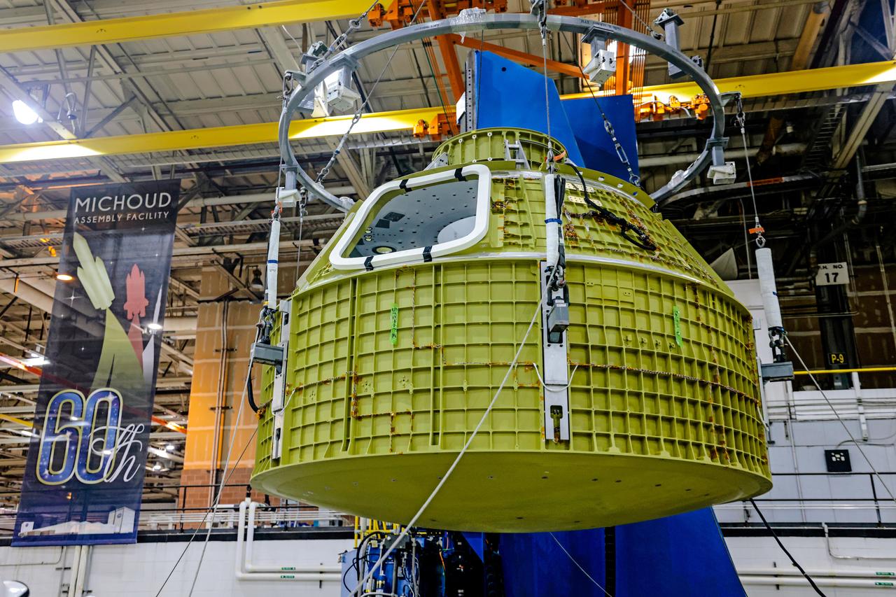 At NASA's Michoud Assembly Facility in New Orleans, Orion's newly completed pressure vessel for the Artemis III mission is lifted out of the welding tool on Aug. 27, 2021. The pressure vessel is the primary structure for Orion's crew module, joined together using state-of-the-art welding by technicians from lead contractor Lockheed Martin.