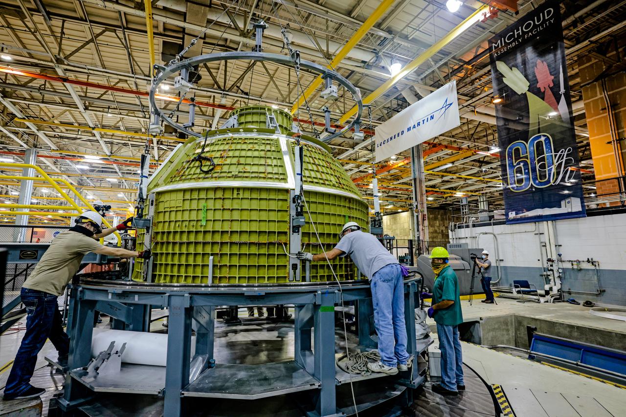 At NASA's Michoud Assembly Facility in New Orleans, Orion's newly completed pressure vessel for the Artemis III mission is lifted out of the welding tool on Aug. 27, 2021. The pressure vessel is the primary structure for Orion's crew module, joined together using state-of-the-art welding by technicians from lead contractor Lockheed Martin.