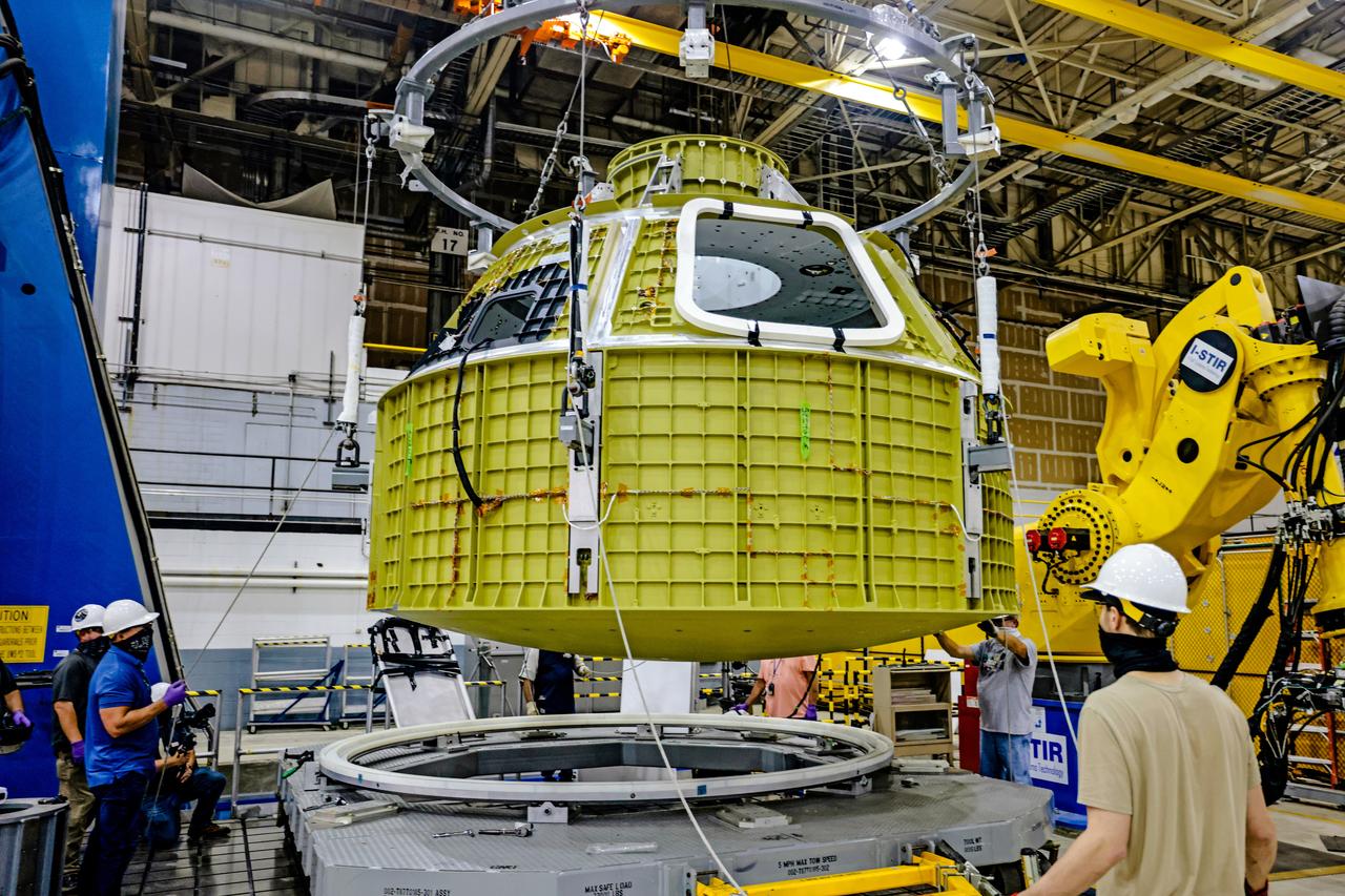 At NASA's Michoud Assembly Facility in New Orleans, Orion's newly completed pressure vessel for the Artemis III mission is lifted out of the welding tool on Aug. 27, 2021. The pressure vessel is the primary structure for Orion's crew module, joined together using state-of-the-art welding by technicians from lead contractor Lockheed Martin.