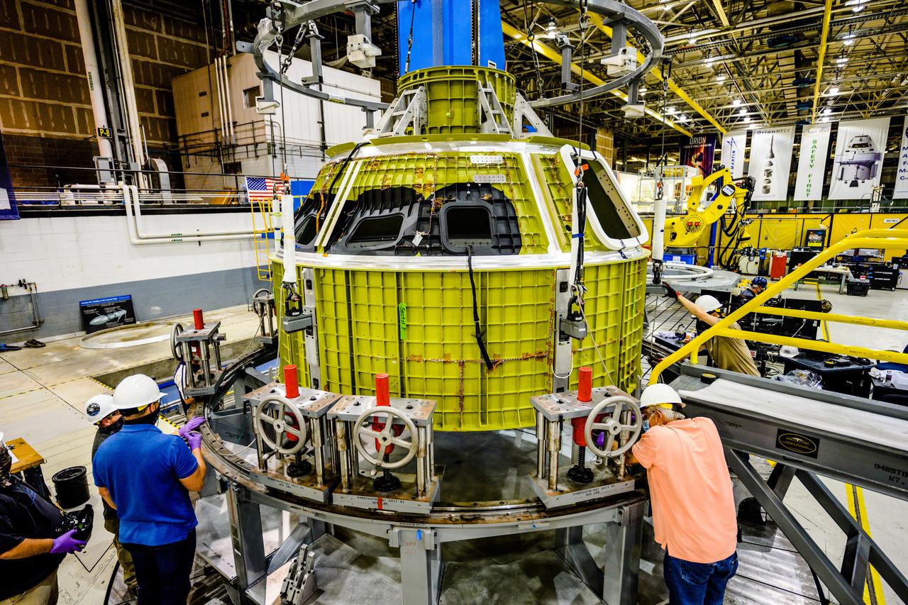 At NASA's Michoud Assembly Facility in New Orleans, Orion's newly completed pressure vessel for the Artemis III mission is lifted out of the welding tool on Aug. 27, 2021. The pressure vessel is the primary structure for Orion's crew module, joined together using state-of-the-art welding by technicians from lead contractor Lockheed Martin.