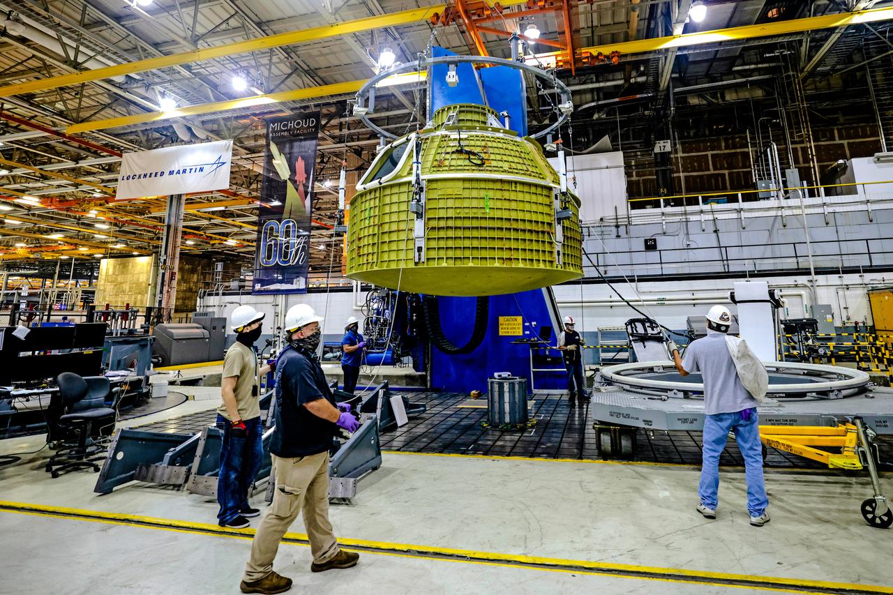 At NASA's Michoud Assembly Facility in New Orleans, Orion's newly completed pressure vessel for the Artemis III mission is lifted out of the welding tool on Aug. 27, 2021. The pressure vessel is the primary structure for Orion's crew module, joined together using state-of-the-art welding by technicians from lead contractor Lockheed Martin.