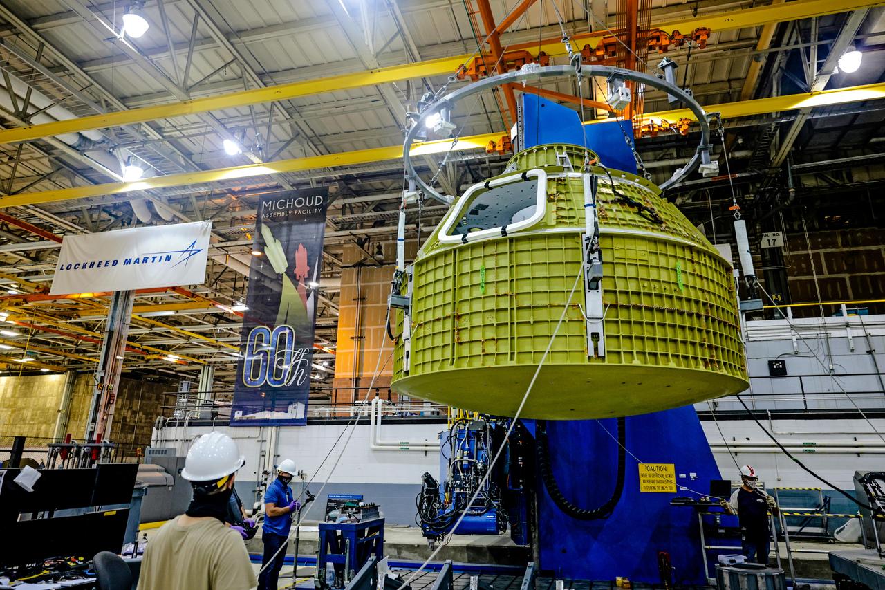 At NASA's Michoud Assembly Facility in New Orleans, Orion's newly completed pressure vessel for the Artemis III mission is lifted out of the welding tool on Aug. 27, 2021. The pressure vessel is the primary structure for Orion's crew module, joined together using state-of-the-art welding by technicians from lead contractor Lockheed Martin.