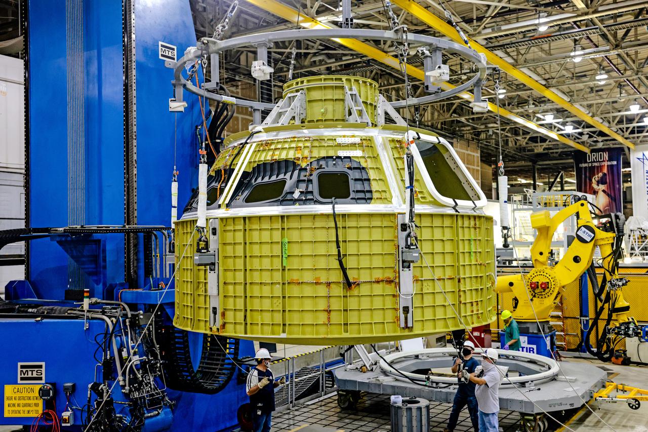 At NASA's Michoud Assembly Facility in New Orleans, Orion's newly completed pressure vessel for the Artemis III mission is lifted out of the welding tool on Aug. 27, 2021. The pressure vessel is the primary structure for Orion's crew module, joined together using state-of-the-art welding by technicians from lead contractor Lockheed Martin.
