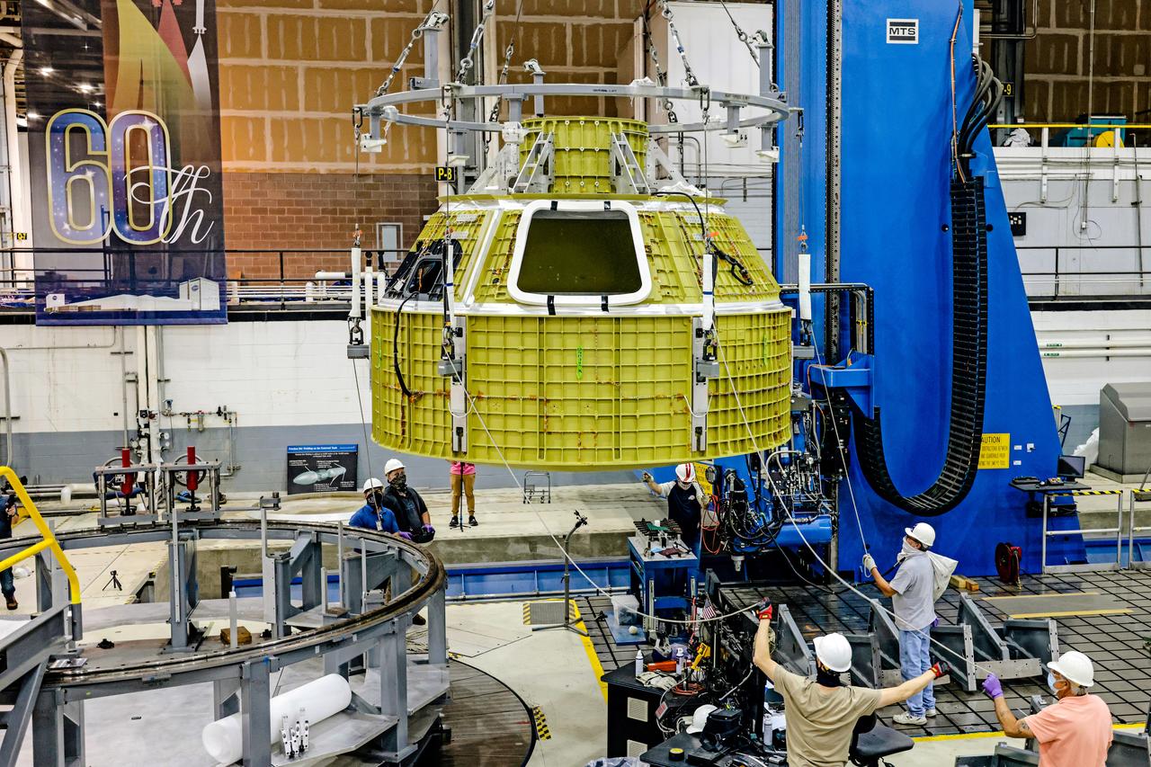 At NASA's Michoud Assembly Facility in New Orleans, Orion's newly completed pressure vessel for the Artemis III mission is lifted out of the welding tool on Aug. 27, 2021. The pressure vessel is the primary structure for Orion's crew module, joined together using state-of-the-art welding by technicians from lead contractor Lockheed Martin.