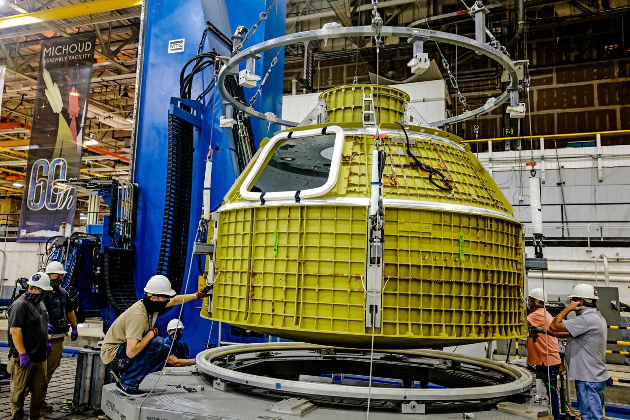 At NASA's Michoud Assembly Facility in New Orleans, Orion's newly completed pressure vessel for the Artemis III mission is lifted out of the welding tool on Aug. 27, 2021. The pressure vessel is the primary structure for Orion's crew module, joined together using state-of-the-art welding by technicians from lead contractor Lockheed Martin.