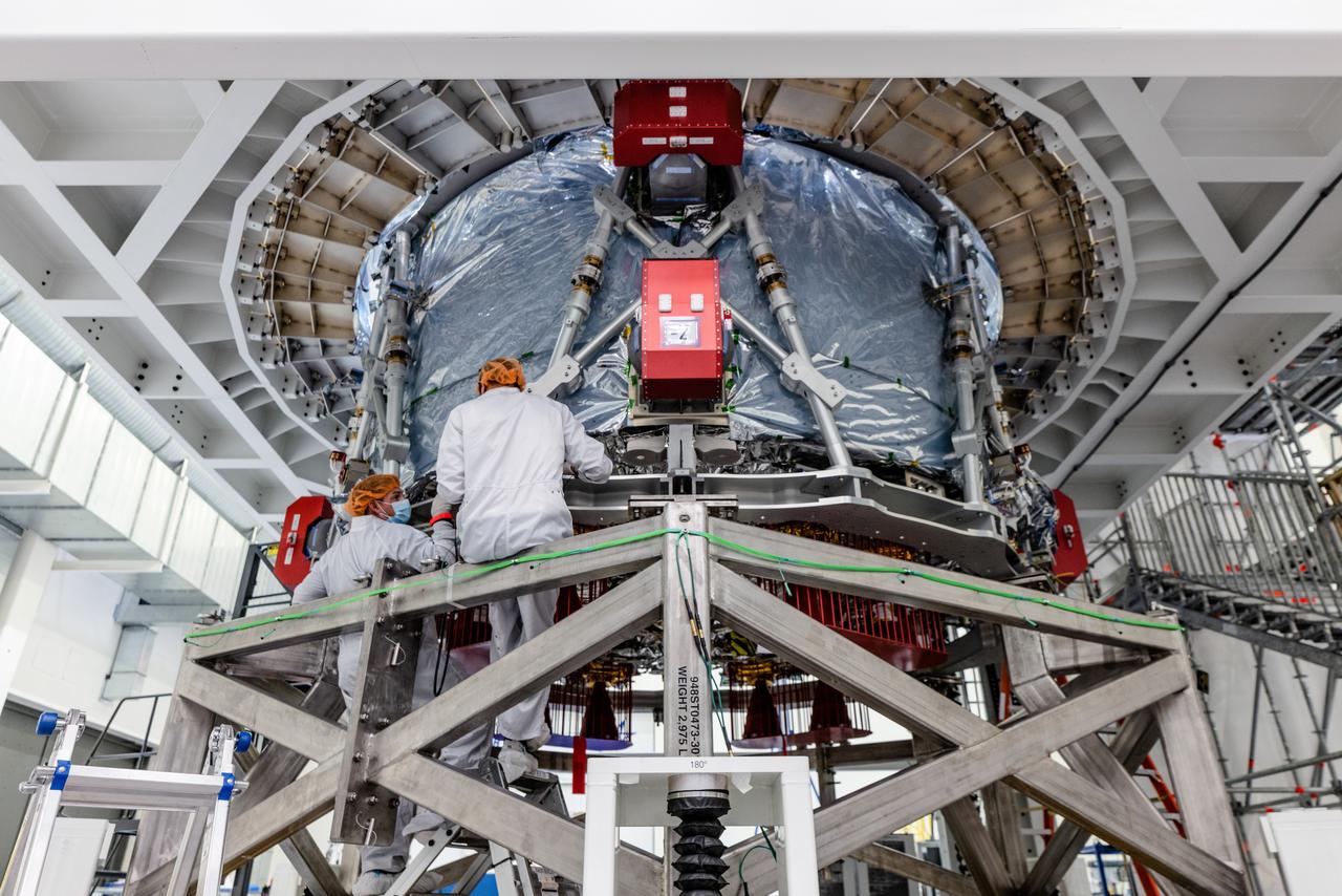 The crew module adapter, which connects Orion's crew module with the European Service module is lifted in preparation for mate with the Artemis II service module on Oct. 19, 2021, which recently arrived from Airbus in Bremen.
