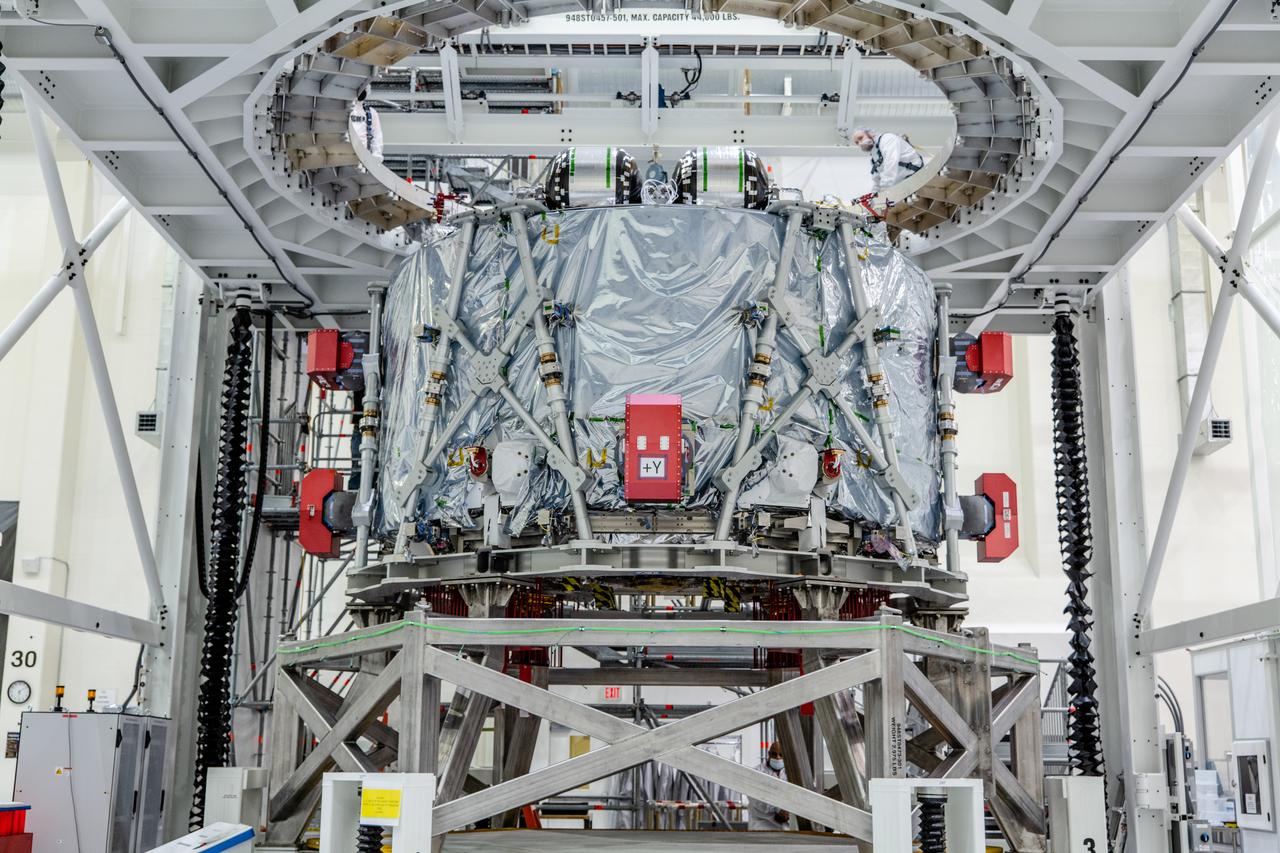 The crew module adapter, which connects Orion's crew module with the European Service module is lifted in preparation for mate with the Artemis II service module on Oct. 19, 2021, which recently arrived from Airbus in Bremen.
