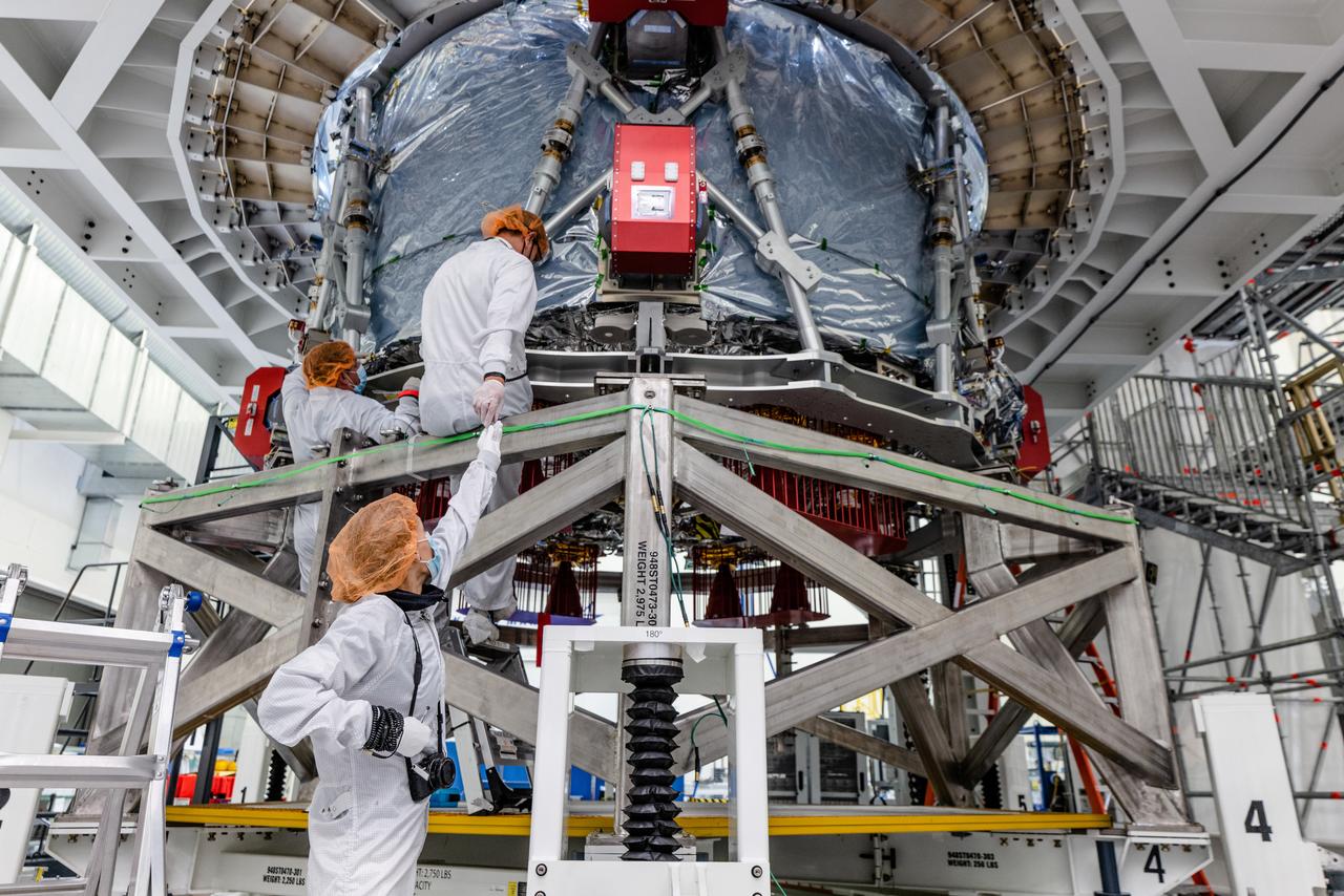 The crew module adapter, which connects Orion's crew module with the European Service module is lifted in preparation for mate with the Artemis II service module on Oct. 19, 2021, which recently arrived from Airbus in Bremen.