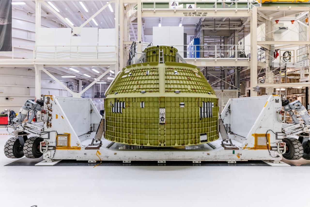 The crew module adapter, which connects Orion's crew module with the European Service module is lifted in preparation for mate with the Artemis II service module on Oct. 19, 2021, which recently arrived from Airbus in Bremen.
