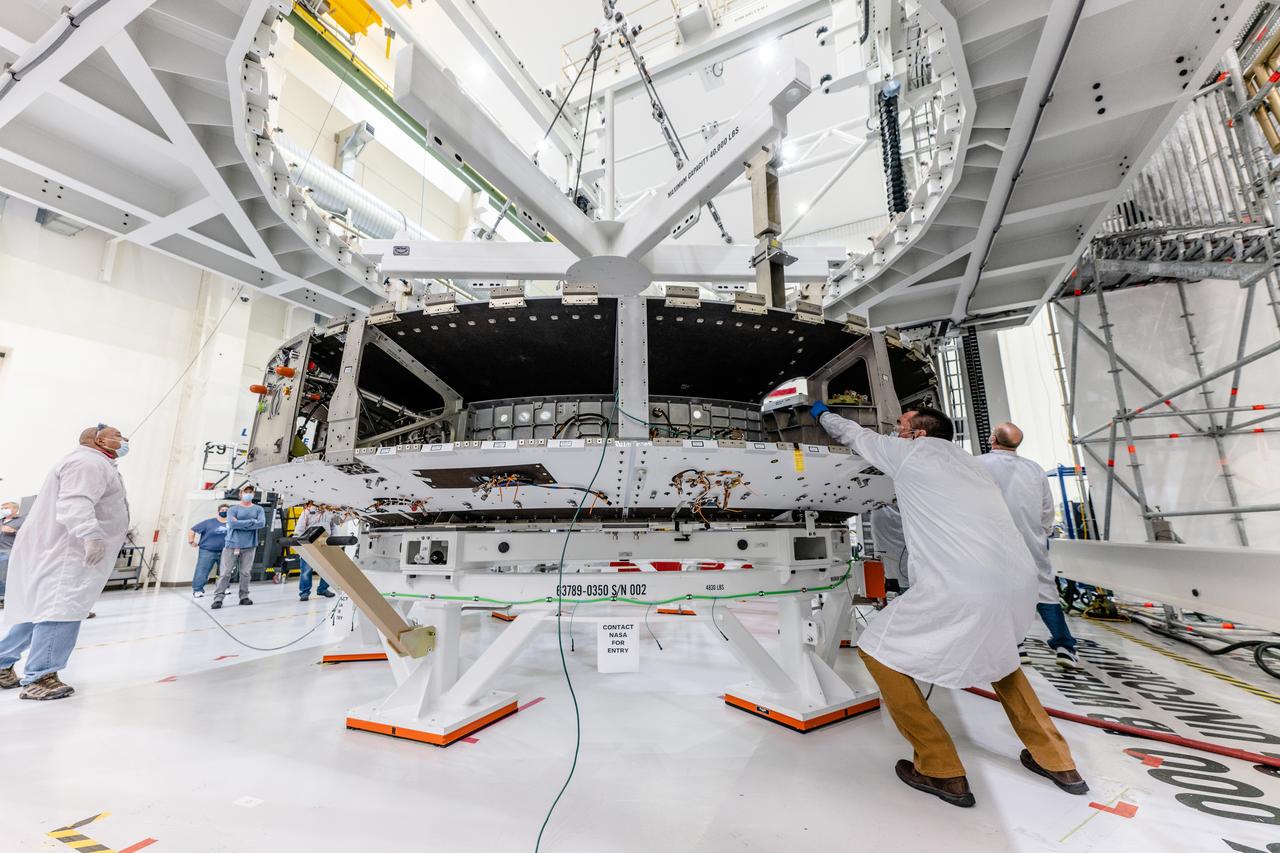 The crew module adapter, which connects Orion's crew module with the European Service module is lifted in preparation for mate with the Artemis II service module on Oct. 19, 2021, which recently arrived from Airbus in Bremen.
