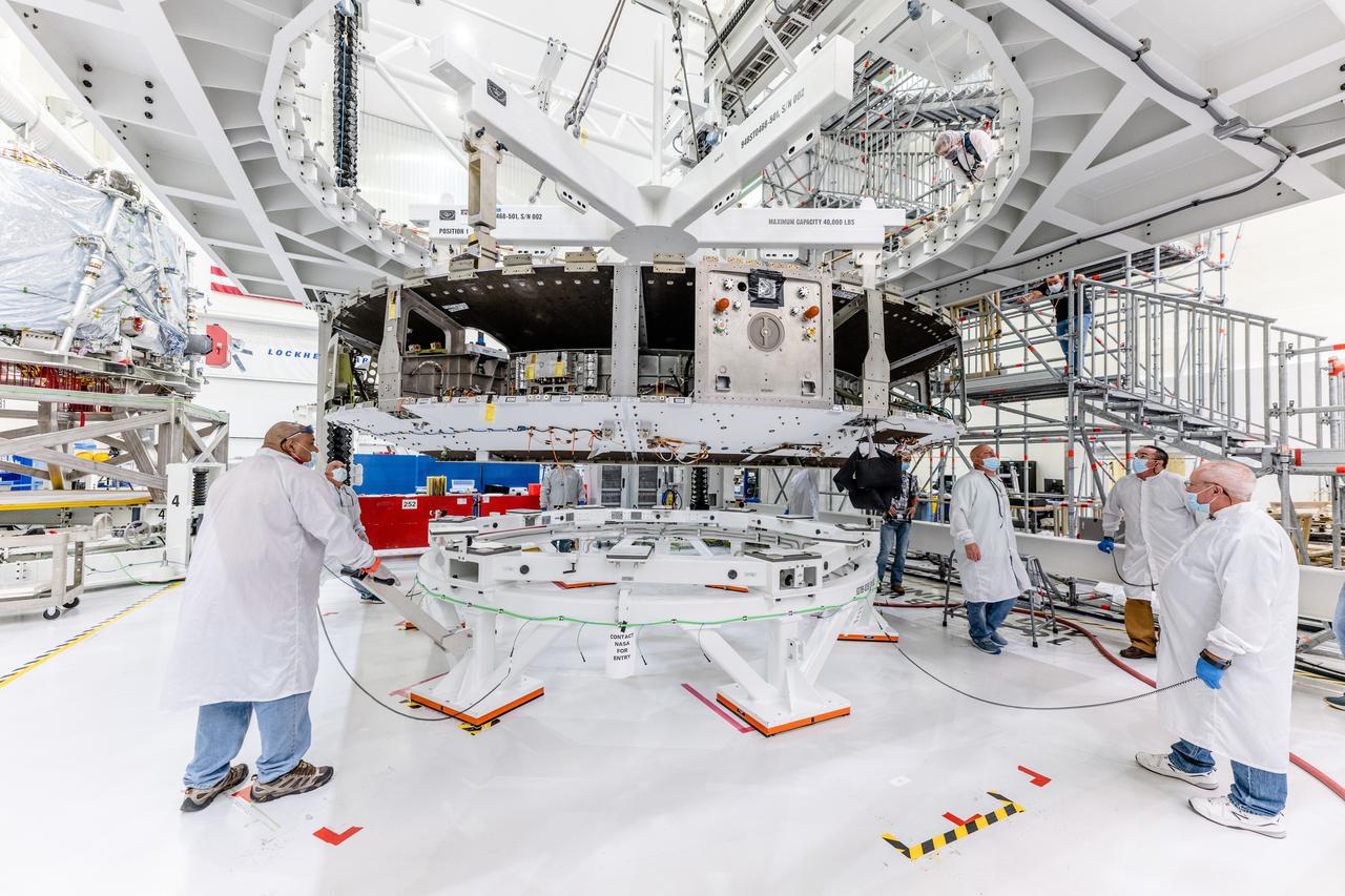 The crew module adapter, which connects Orion's crew module with the European Service module is lifted in preparation for mate with the Artemis II service module on Oct. 19, 2021, which recently arrived from Airbus in Bremen.