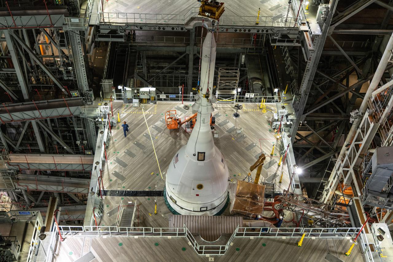 The Orion spacecraft for NASA’s Artemis I mission, fully assembled with its launch abort system, is stacked on the Space Launch System (SLS) rocket in High Bay 3 of the Vehicle Assembly Building at Kennedy Space Center in Florida on Oct. 20, 2021. The stacking of Orion on top of the SLS completes assembly for the Artemis I flight test. Teams will begin conducting a series of verification tests ahead of rolling out to Launch Complex 39B for the Wet Dress Rehearsal.