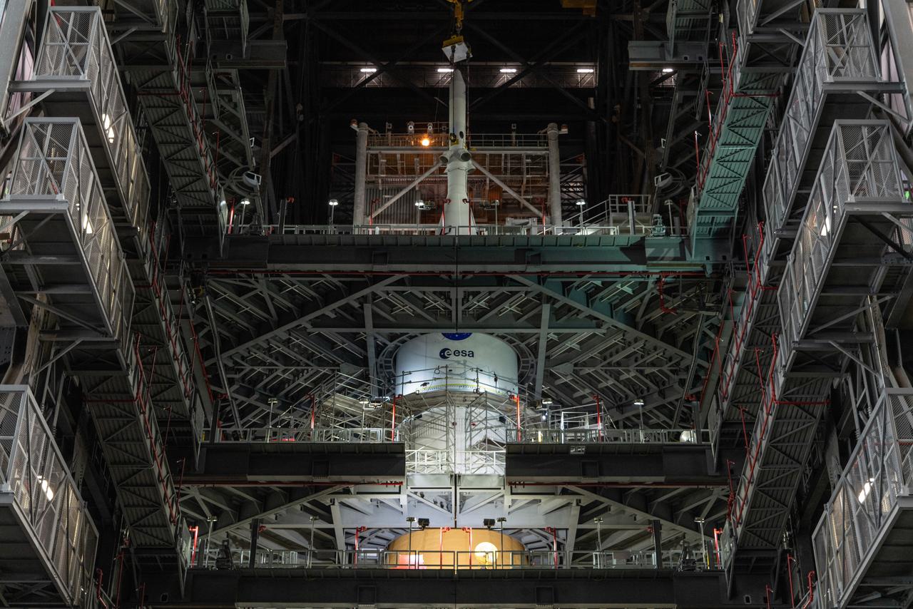 The Orion spacecraft for NASA’s Artemis I mission, fully assembled with its launch abort system, is stacked on the Space Launch System (SLS) rocket in High Bay 3 of the Vehicle Assembly Building at Kennedy Space Center in Florida on Oct. 20, 2021. The stacking of Orion on top of the SLS completes assembly for the Artemis I flight test. Teams will begin conducting a series of verification tests ahead of rolling out to Launch Complex 39B for the Wet Dress Rehearsal.