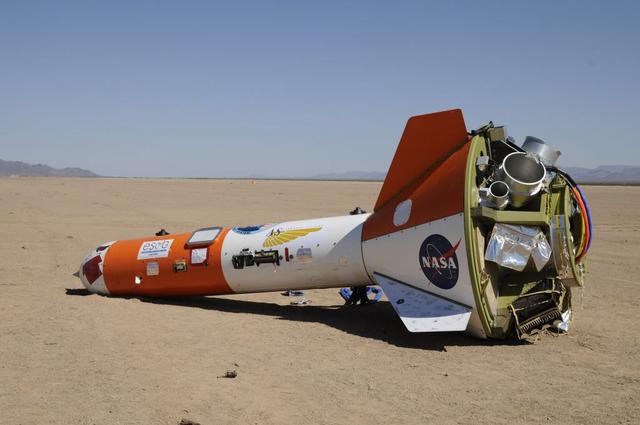 The Orion team performed the first of a series of development tests at U.S. Army Yuma Proving Grounds on Sept. 27, 2011. The photo shows the test article after it landed on the desert floor and the parachutes have been removed.