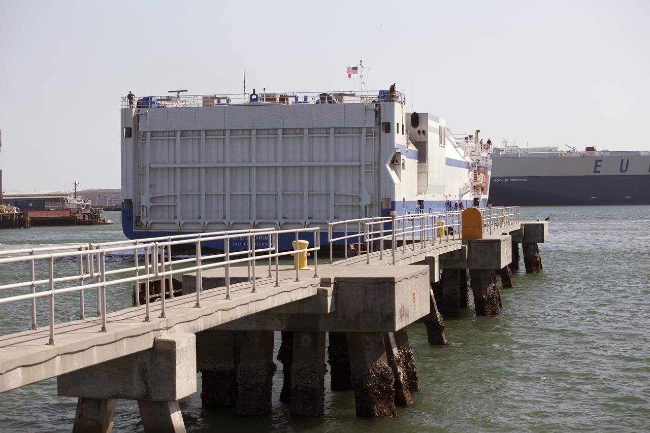 The United Launch Alliance barge Delta Mariner nears the dock in Port Canaveral in Florida on March 6, 2014. The barge is carrying two of the booster stages for the Delta IV Heavy rocket slated for Orion's Exploration Flight Test-1, or EFT-1. Orion is the exploration spacecraft designed to carry astronauts to destinations not yet explored by humans. It will have emergency abort capability, sustain the crew during space travel and provide safe re-entry from deep-space return velocities.