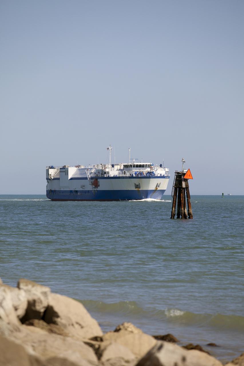The United Launch Alliance barge Delta Mariner enters Port Canaveral in Florida on March 6, 2014. The barge is carrying two of the booster stages for the Delta IV Heavy rocket slated for Orion's Exploration Flight Test-1, or EFT-1. Orion is the exploration spacecraft designed to carry astronauts to destinations not yet explored by humans. It will have emergency abort capability, sustain the crew during space travel and provide safe re-entry from deep-space return velocities.