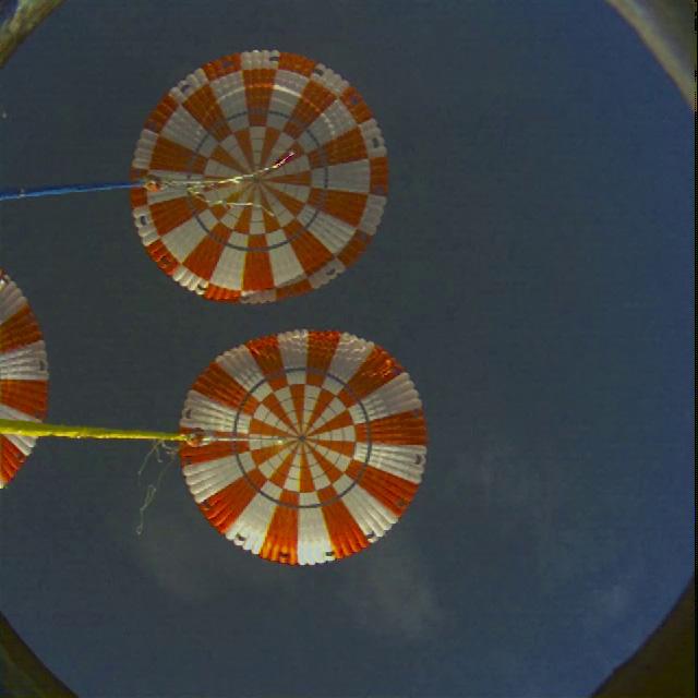 A view from the top hatch window as the parachutes deploy on Orion's first flight test, Exploration Flight Test-1 (EFT-1), on December 5, 2014.