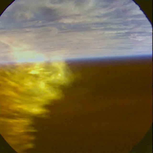 A view from the top hatch window as plasma surrounds the vehicle during reentry on Orion's first flight test, Exploration Flight Test-1 (EFT-1), on December 5, 2014.