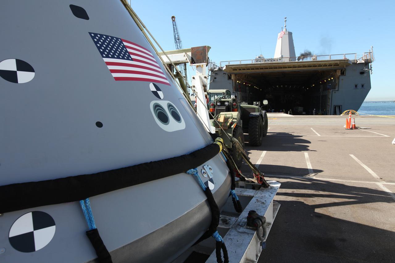 A test version of the Orion crew module seen outside the USS San Diego for Underway Recovery Test 5 on Oct. 27, 2016. NASA's Ground Systems Development and Operations Program and the U.S. Navy will conduct a series of tests using the ship's well deck, the test module, various watercraft and equipment to prepare for recovery of Orion on its return from deep space missions. The test will allow the team to demonstrate and evaluate recovery processes, procedures, hardware and personnel in open waters.