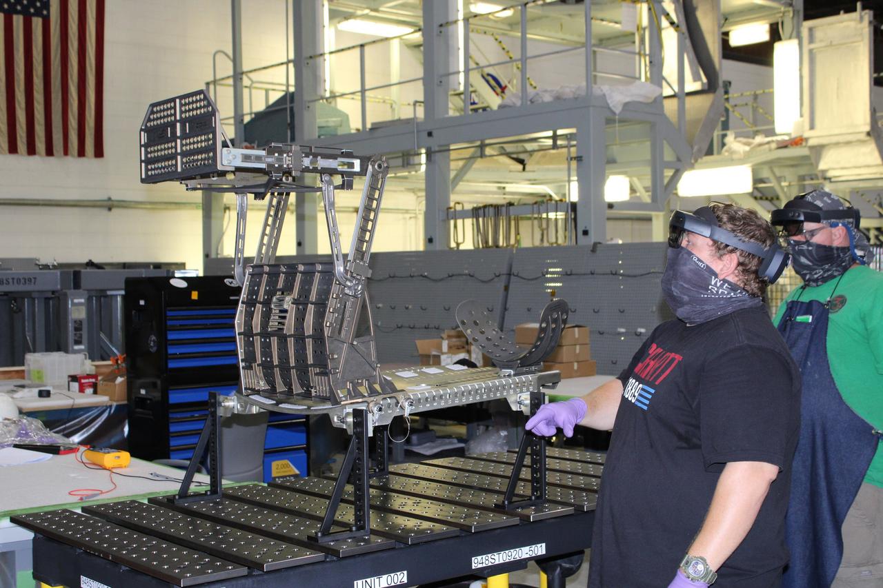 Lockheed Martin technicians at Michoud Assembly Facility in New Orleans complete the final assembly of the crew seat for the Artemis I flight on Sept. 23, 2020. The seat will hold a mass simulator and measure launch and landing loads during the flight which will see Orion travel 40,000 miles past the Moon. The seat will also be reused on Artemis II, Orion's first crewed flight.