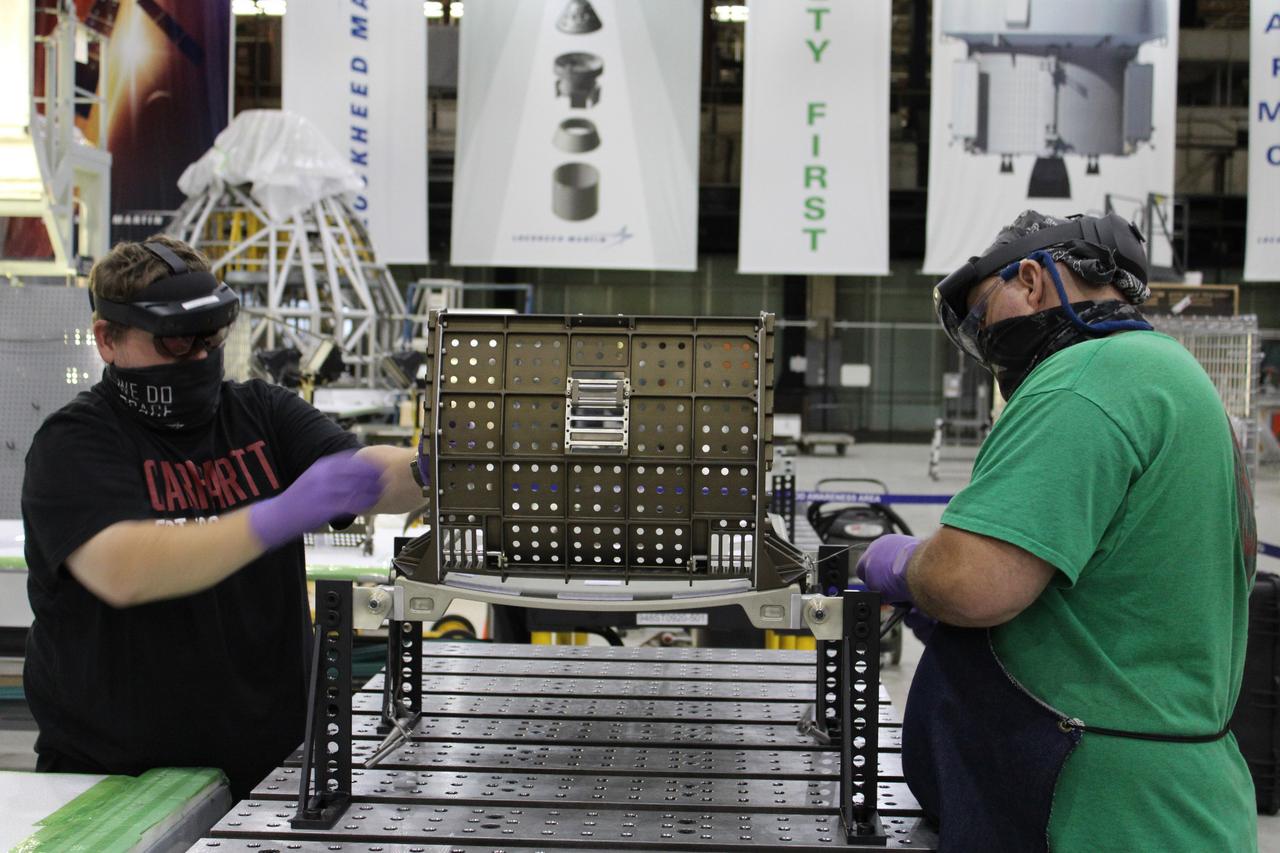 Lockheed Martin technicians at Michoud Assembly Facility in New Orleans complete the final assembly of the crew seat for the Artemis I flight on Sept. 23, 2020. The seat will hold a mass simulator and measure launch and landing loads during the flight which will see Orion travel 40,000 miles past the Moon. The seat will also be reused on Artemis II, Orion's first crewed flight.