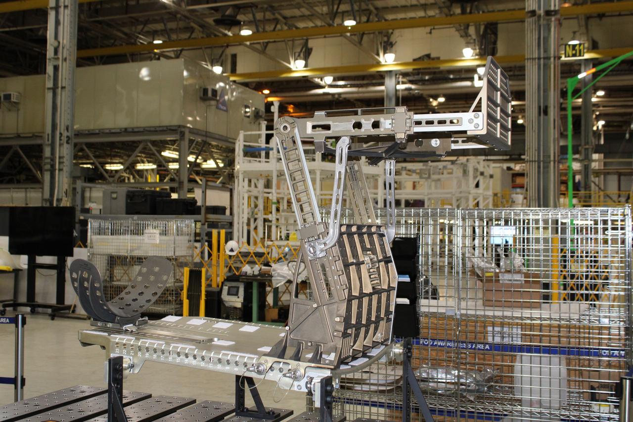 Lockheed Martin technicians at Michoud Assembly Facility in New Orleans complete the final assembly of the crew seat for the Artemis I flight on Sept. 23, 2020. The seat will hold a mass simulator and measure launch and landing loads during the flight which will see Orion travel 40,000 miles past the Moon. The seat will also be reused on Artemis II, Orion's first crewed flight.