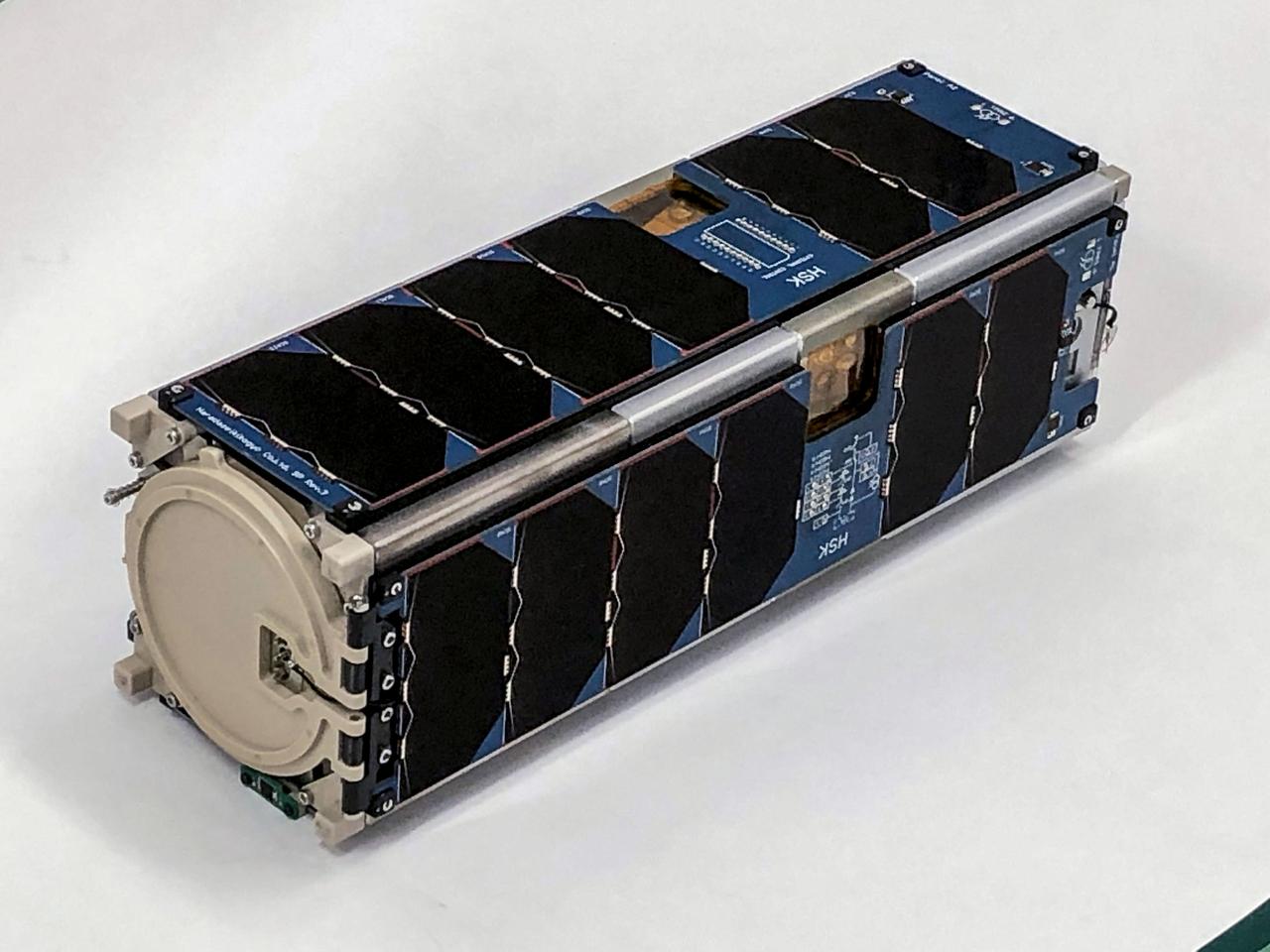 jsc2022e064081 (6/21/2022) --- A preflight view of theHSKSAT Flight Model. HSKSAT is a 3.9 kg, 3-Unit (3U) CubeSat developed by the Harada Seiki Company. HSKSAT's mission is to demonstrate attitude-controlled Earth observation, and provide high-speed imagery downlink utilizing S-band radio communications.  Image Credit: Harada Seiki Corporation.