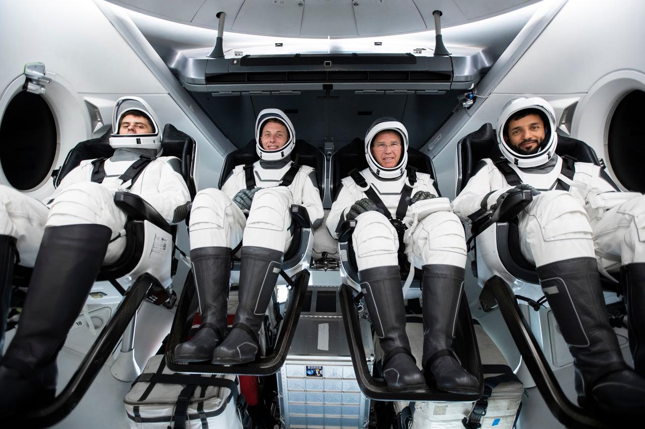 jsc2022e065066 (March 24, 2022) --- The four crew members that comprise the SpaceX Crew-6 mission are seated inside the SpaceX Dragon crew ship during a training session at the company's headquarters in Hawthorne, California. Seated from left in their spacesuits are, Mission Specialist Andrey Fedyaev, Pilot Warren "Woody" Hoburg, Commander Stephen Bowen, and Mission Specialist Sultan Alnedayi. Credit: SpaceX