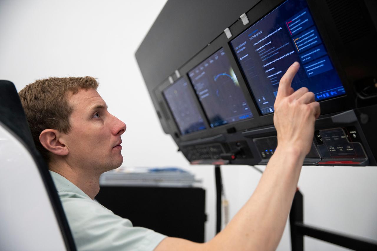 jsc2022e065067 (March 24, 2022) --- SpaceX Crew-6 Pilot Warren "Woody" Hoburg of NASA is pictured during a cockpit training session at the company's headquarters in Hawthorne, California. Credit: SpaceX