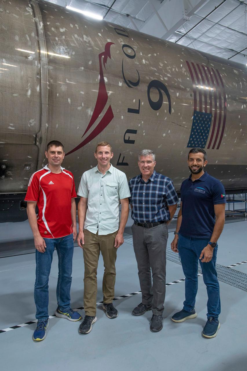 jsc2022e065073 (Aug. 9, 2022) --- The four crew members that comprise the SpaceX Crew-6 mission pose for a photo inside SpaceX Hangar X at the Kennedy Space Center in Florida. Hangar X supports Falcon 9 rocket refurbishment and houses administration offices. From left are, Mission Specialist Andrey Fedyaev, Pilot Warren "Woody" Hoburg, Commander Stephen Bowen, and Mission Specialist Sultan Alneyadi. Credit: SpaceX