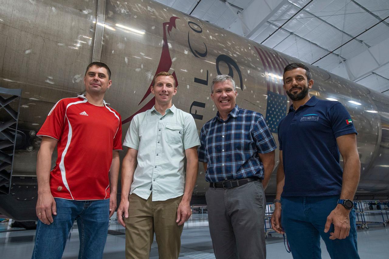 jsc2022e065075 (Aug. 9, 2022) --- The four crew members that comprise the SpaceX Crew-6 mission pose for a photo inside SpaceX Hangar X at the Kennedy Space Center in Florida. Hangar X supports Falcon 9 rocket refurbishment and houses administration offices. From left are, Mission Specialist Andrey Fedyaev, Pilot Warren "Woody" Hoburg, Commander Stephen Bowen, and Mission Specialist Sultan Alneyadi. Credit: SpaceX