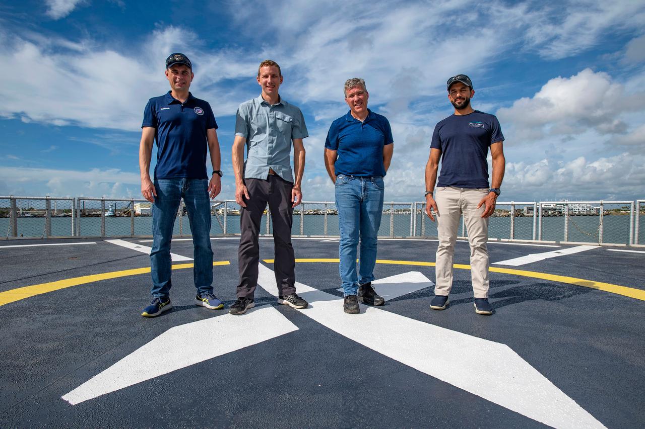 jsc2022e065076 (Aug. 9, 2022) --- The four crew members that comprise the SpaceX Crew-6 mission pose for a photo on the SpaceX helipad at the Kennedy Space Center in Florida. From left are, Mission Specialist Andrey Fedyaev, Pilot Warren "Woody" Hoburg, Commander Stephen Bowen, and Mission Specialist Sultan Alneyadi. Credit: SpaceX