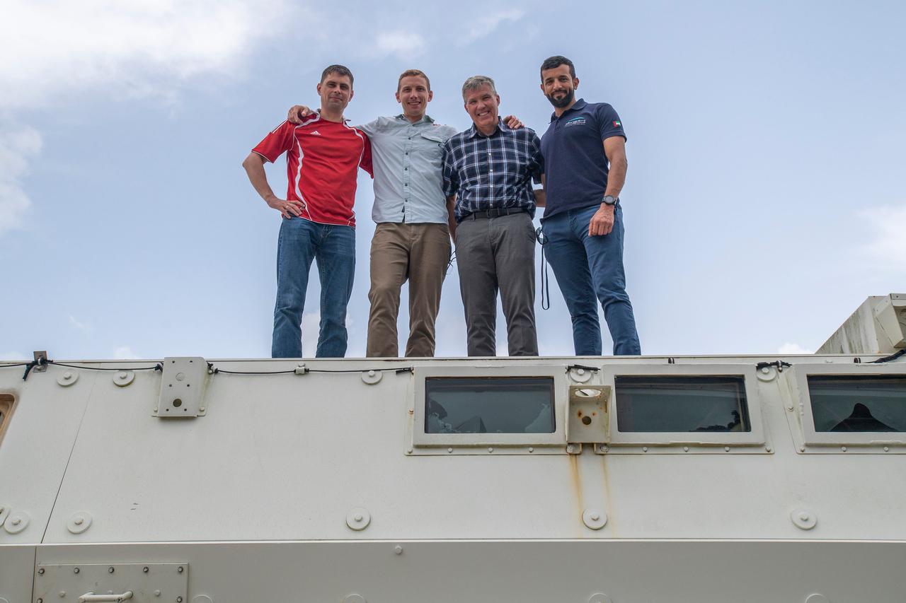 jsc2022e065077 (Aug. 9, 2022) --- The four crew members that comprise the SpaceX Crew-6 mission pose for a photo atop an emergency egress vehicle at the Kennedy Space Center's Launch Pad 39A in Florida. Crews would use the emergency egress vehicle to quickly leave the launch area in case of an emergency. From left are, Mission Specialist Andrey Fedyaev, Pilot Warren "Woody" Hoburg, Commander Stephen Bowen and Mission Specialist Sultan Alneyadi. Credit: SpaceX