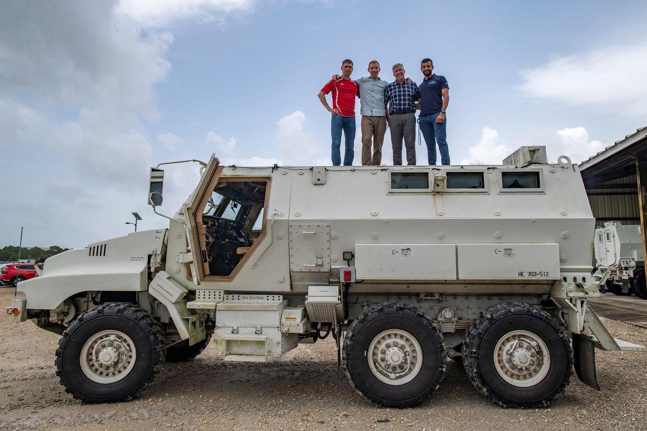 jsc2022e065078 (Aug. 9, 2022) --- The four crew members that comprise the SpaceX Crew-6 mission pose for a photo atop an emergency egress vehicle at the Kennedy Space Center's Launch Pad 39A in Florida. Crews would use the emergency egress vehicle to quickly leave the launch area in case of an emergency. From left are, Mission Specialist Andrey Fedyaev, Pilot Warren "Woody" Hoburg, Commander Stephen Bowen, and Mission Specialist Sultan Alnedayi. Credit: SpaceX