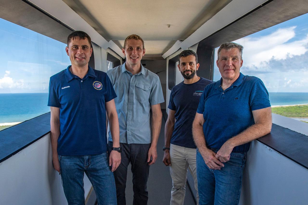 jsc2022e065088 (Aug. 8, 2022) --- The four crew members that comprise the SpaceX Crew-6 mission pose for a photo during a training session on the crew access arm at the Kennedy Space Center's Launch Pad 39A in Florida. From left are, Mission Specialist Andrey Fedyaev, Pilot Warren "Woody" Hoburg, Mission Specialist Sultan Alneyadi, and Commander Stephen Bowen. Credit: SpaceX