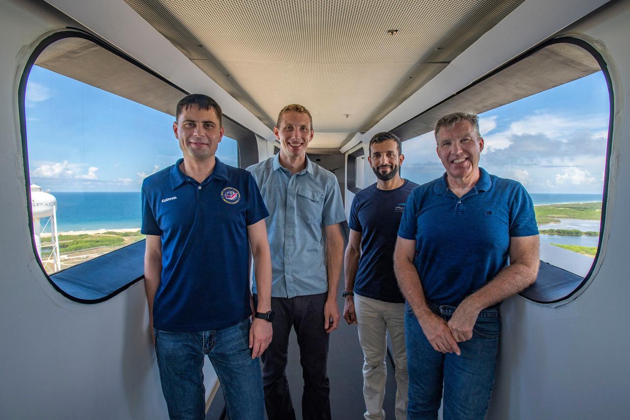 jsc2022e065089 (Aug. 8, 2022) --- The four crew members that comprise the SpaceX Crew-6 mission pose for a photo during a training session on the crew access arm at the Kennedy Space Center's Launch Pad 39A in Florida. From left are, Mission Specialist Andrey Fedyaev, Pilot Warren "Woody" Hoburg, Mission Specialist Sultan Alneyadi, and Commander Stephen Bowen. Credit: SpaceX