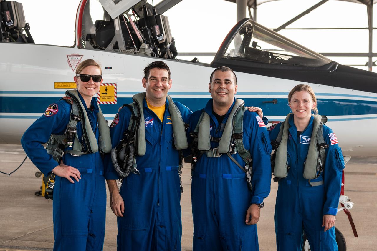 From left to right, NASA Astronaut Candidates Nichole "Vapor" Ayers and Jack "Radio" Hathaway, NASA Scientific Photographer Josh Valcarcel, and NASA Astronaut Zena Cardman pose for a photo in front of a T-38 aircraft at Ellington Field in Houston. Credit: NASA/Alphonso Forbes