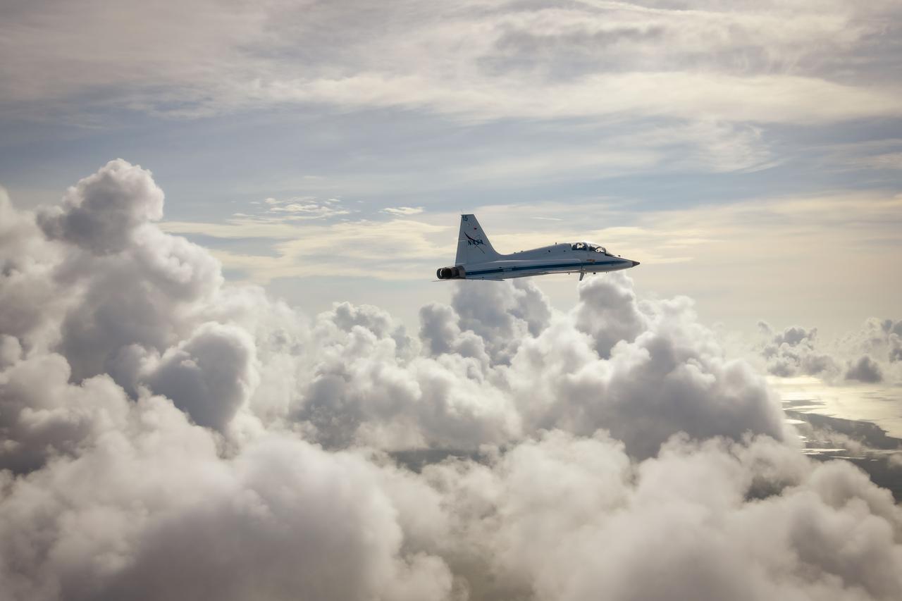 A NASA T-38 aircraft is seen during a flight over Artemis-1 vehicle at launch pad at the Kennedy Space Center.   PHOTOGRAPHER: Josh Valcarcel