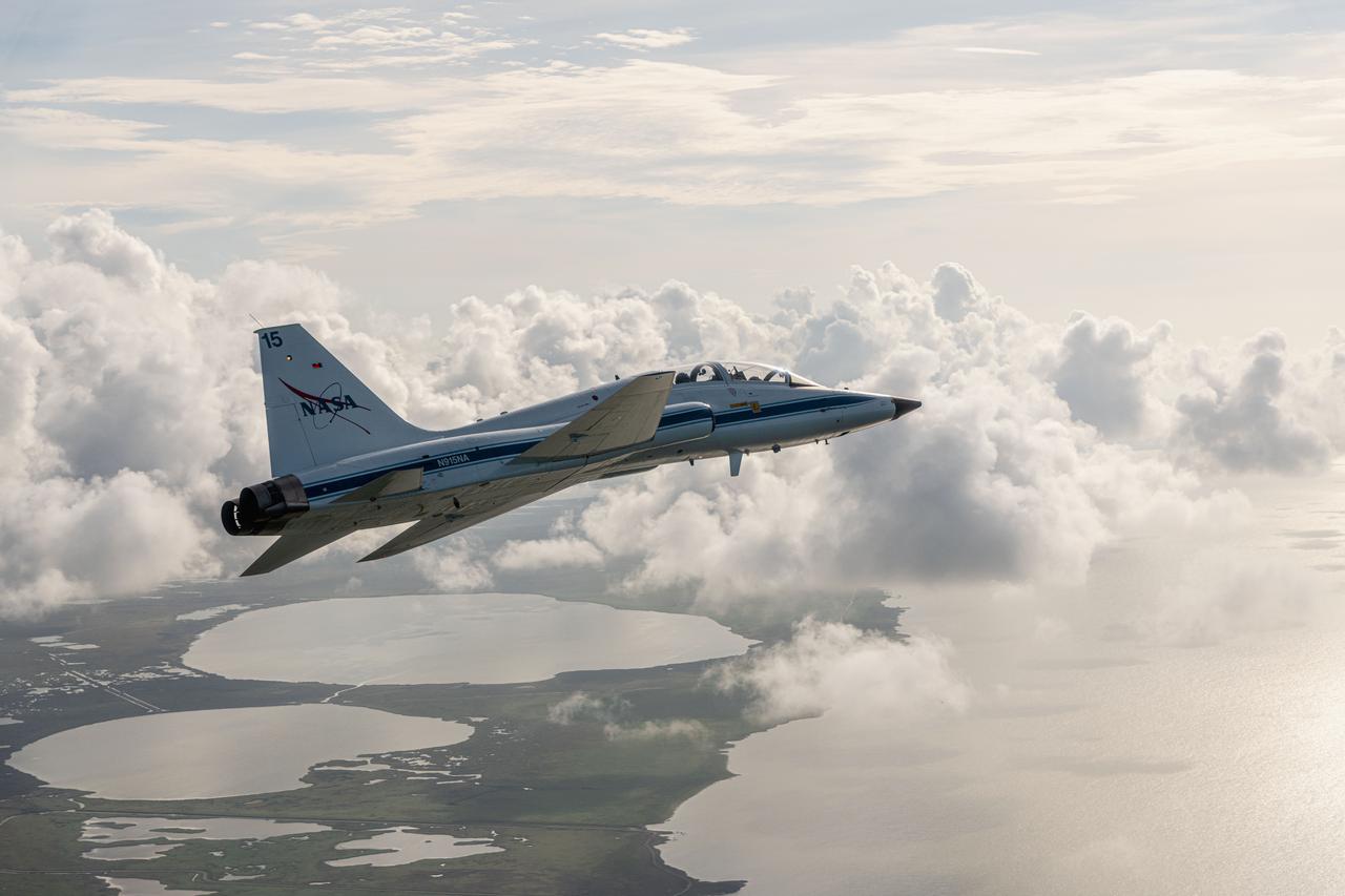 A NASA T-38 aircraft is seen during a flight over Artemis-1 vehicle at launch pad at the Kennedy Space Center.   PHOTOGRAPHER: Josh Valcarcel