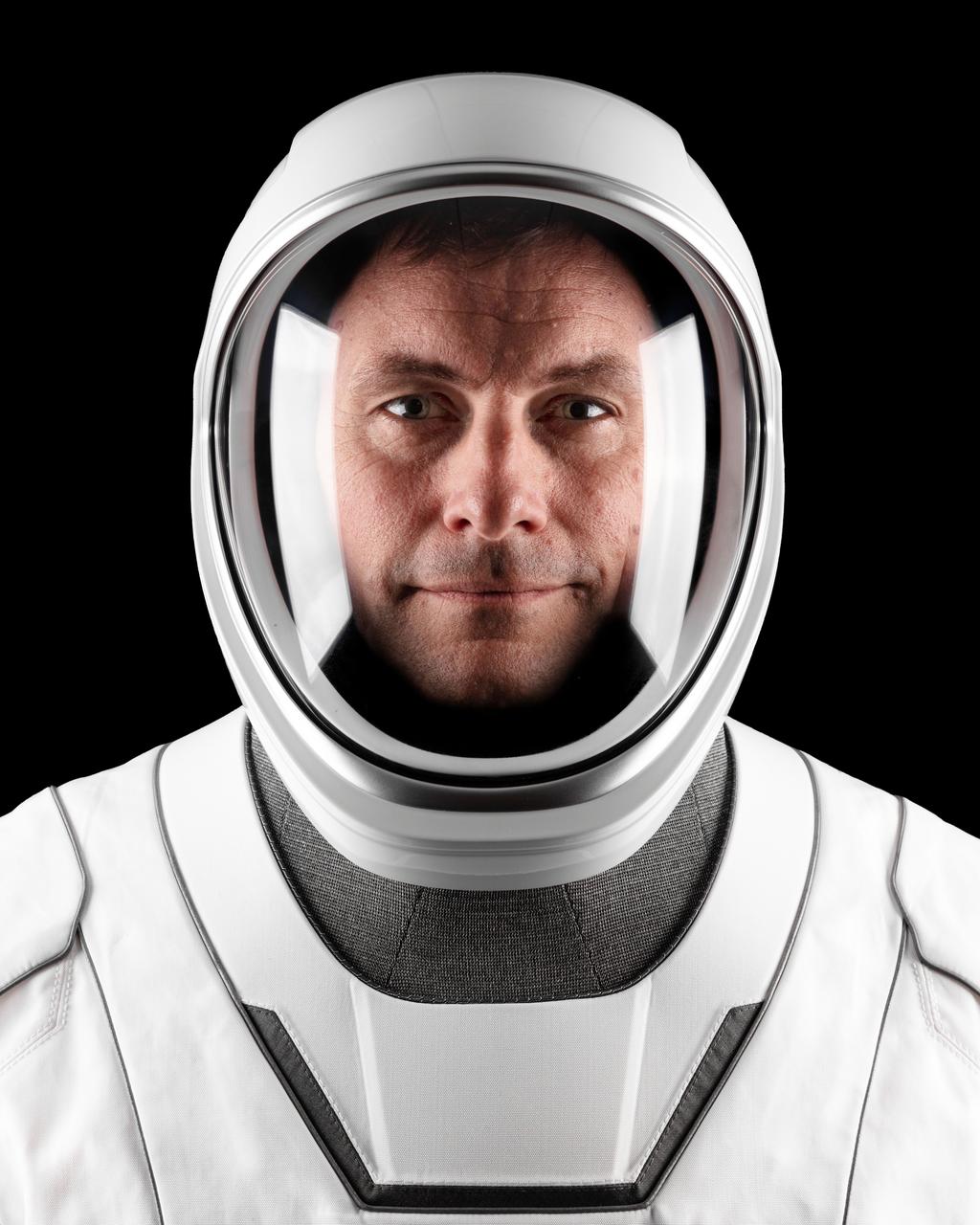 jsc2022e068598 (Aug. 19, 2022) --- Astronaut Josh Cassada of NASA's Commercial Crew Program, SpaceX Crew-5 Pilot, poses for a portrait in his pressure suit at SpaceX headquarters in Hawthorne, California. Credit: SpaceX