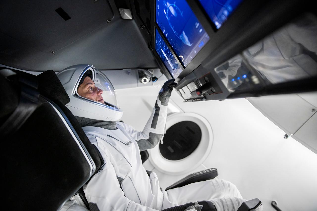 jsc2022e068607 (June 13, 2022) --- SpaceX Crew-5 Commander Nicole Aunapu Mann from NASA is pictured during a Crew Dragon cockpit training session at SpaceX headquarters in Hawthorne, California. Credit: SpaceX