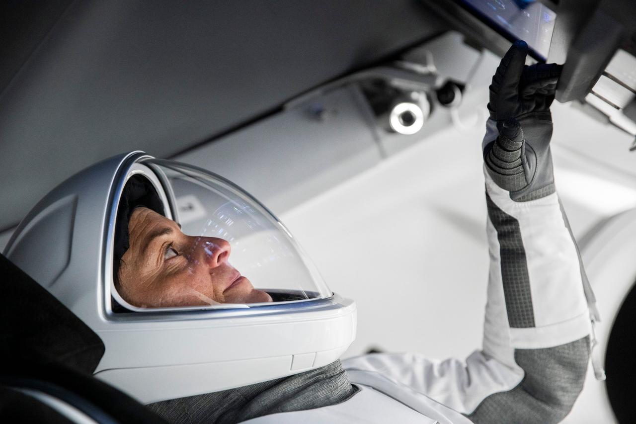 jsc2022e068608 (June 13, 2022) --- SpaceX Crew-5 Commander Nicole Aunapu Mann from NASA is pictured during a Crew Dragon cockpit training session at SpaceX headquarters in Hawthorne, California. Credit: SpaceX
