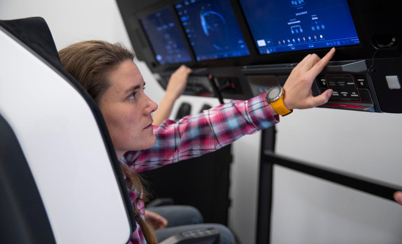 jsc2022e068617 (Dec. 7, 2021) --- SpaceX Crew-5 Mission Specialist Anna Kikina from Roscosmos is pictured during a Crew Dragon cockpit training session at SpaceX headquarters in Hawthorne, California. Credit: SpaceX