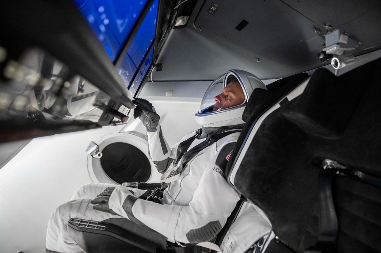 jsc2022e068648 (Aug. 17, 2022) --- SpaceX Crew-5 Pilot Josh Cassada of NASA is pictured during a Crew Dragon cockpit training session at SpaceX headquarters in Hawthorne, California. Credit: SpaceX