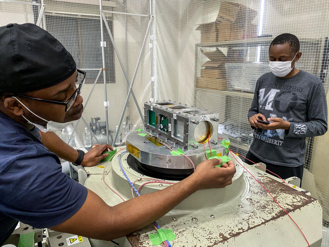 jsc2022e072954 (10/17/2021) --- The BIRDS-5 team from Zimbabwe conducts vibration testing. BIRDS-5 is a constellation of CubeSats developed by Uganda, Zimbabwe, and Japan that will be deployed from the space station. Image courtesy of BIRDS-5.